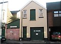 Contrasting garages in Adair Road