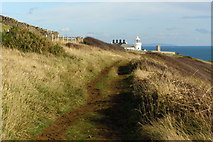 SZ0276 : Coast path approaching Anvil Point lighthouse by Jim Champion