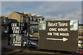 Boat trip notice boards at Millport Harbour