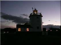 TG2341 : The lighthouse at dusk, Cromer by Humphrey Bolton