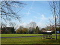 Looking across Lees Court Road towards the cricket pitch