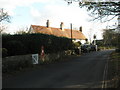 Postbox approaching The Black Horse