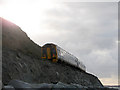 A train from Harlech in the shadow of Harlech Cliff