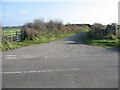 Mouth of a minor road leading to the village of  Bryn Du