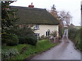 Cottage and country lane near Clyst St Mary