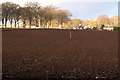 View of Dykehead Village across a ploughed field