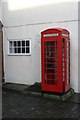 Telephone box by the wall