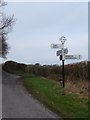 SY9382 : East Creech: finger-post by Chris Downer