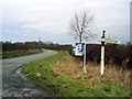 SJ4350 : 19th century guidepost by the road to Farndon by John S Turner