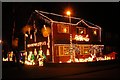 House decorated with Christmas lights at Moreton Hall