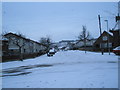 Looking north-west up a snowy  Elkstone Road