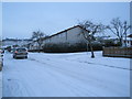 Approaching the snowy junction of Collington Crescent with Elkstone Road