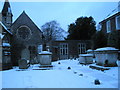 Tombs by the church hall at St Peter and St Paul, Wymering