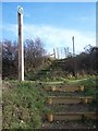 Steps, road, steps and kissing gate on footpath