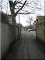 Alley from Portsmouth Road emerges into Flower Walk