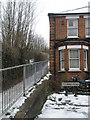 Railings dividing Testard Road from the path down to the A31