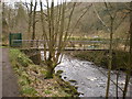 Footbridge across Hebden Water to the bowling green below Lee Mill Bridge