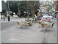 Empty  seats and tables in Thames Street