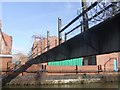 SO9891 : Wednesbury Old Canal - Factory Access Bridge by John M