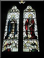 Detailed stained glass window on the north wall at St Peter