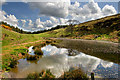 NT9824 : Small lake near Happy Valley in lower Cheviots by Mark Evans