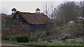 Pond and outbuildings at Scratchings Farm