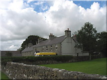 SH5084 : Houses facing the Green at Marian-Glas by Eric Jones