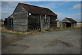 Wooden sheds at Hinton Cross