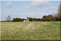 Looking across a field to Hartley Mauditt