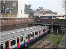TQ2478 : District Line Trains arriving and departing at West Kensington Underground Station by Robin Sones