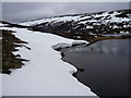 NO0678 : Remnants of snow on rim of Loch nan Eun by Alan O'Dowd