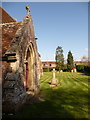 Charlton All Saints: church porch and churchyard