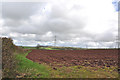 Pylons and ploughed field west of Meinciau