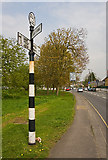 TQ2497 : A1000 and Old Signpost by Martin Addison