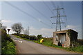 Crossroads, bus shelter and pylon north west of Meinciau