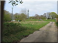 Reservoir and masts as seen through locked gates