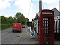 Telephone box and Postal van outside Barns Green Post Office