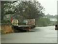 Man operating swing bridge