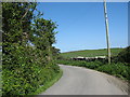 Sharp bend in the road near the former Rhosbeirio Chapel