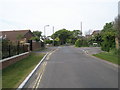 Looking up Bound Lane towards the junctions with The Sanderlings and Wyborn Court