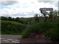 Road sign at crossroad