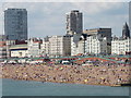 TQ3103 : Crowded Brighton beach seen from Palace Pier by David Hawgood