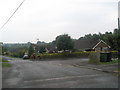 Postman at the junction of Tilmore Gardens and Selborne Close