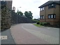 Wall alongside Busby station