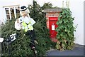 Scarecrow by the post box