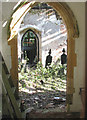 TG2504 : The church of St Wandregesilius - view through south doorway by Evelyn Simak