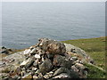 SH2990 : Cliff top cairn north of Porth y Dwfr by Eric Jones