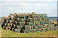 Lobster pots stacked by shore south of Boulmer village