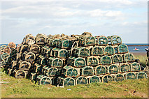 NU2613 : Lobster pots stacked by shore south of Boulmer village by Andy F