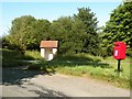 A bus shelter and postbox in Hawstead village